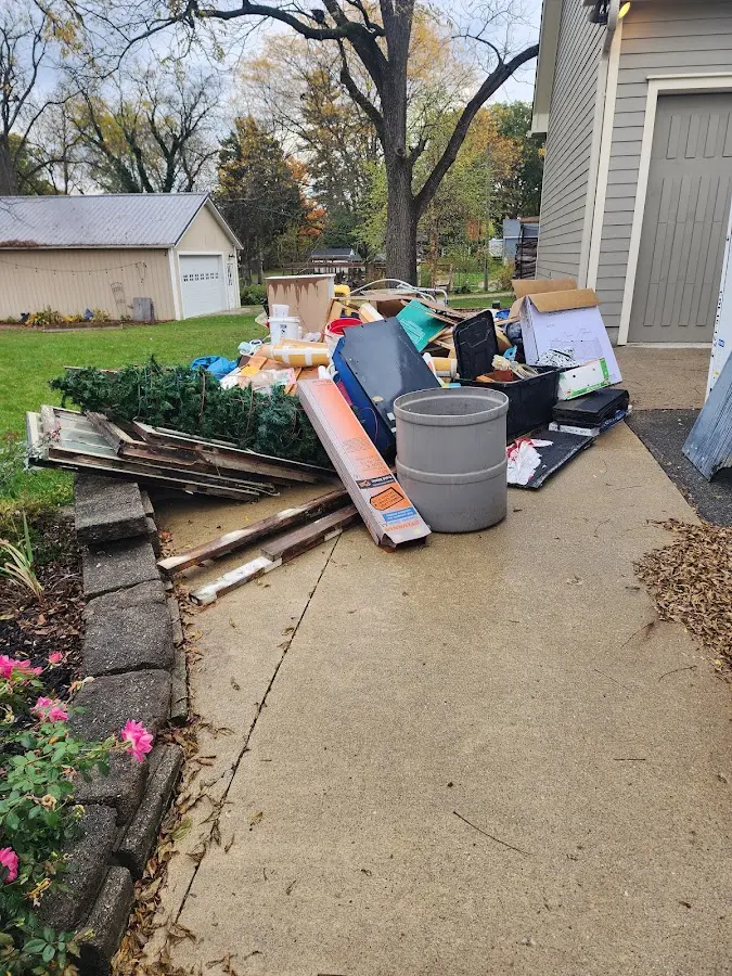 Dumpster being loaded with debris for 30 Yard Dumpster Rental in Coral Terrace